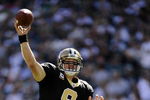 PHILADELPHIA - SEPTEMBER 20:  Drew Brees #9 of the New Orleans Saints looks for an open man during a game against the Philadelphia Eagles at Lincoln Financial Field on September 20, 2009 in Philadelphia, Pennsylvania.  (Photo by Jeff Zelevansky/Getty Images)
