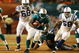 MIAMI - SEPTEMBER 21: Running back Ricky Williams #34 of the Miami Dolphins looks for room to run after getting past linebacker Gary Brackett #58 of the Indianapolis Colts at Land Shark Stadium on September 21, 2009 in Miami, Florida. The Colts defeated the Dolphins 27-23. (Photo by Doug Benc/Getty Images)