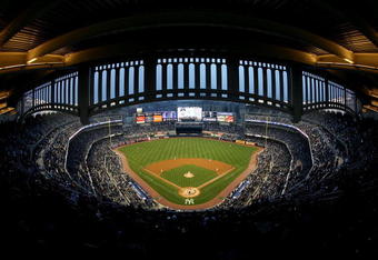 NEW YORK - APRIL 03:  Chien-Ming Wang #40 of the New York Yankees pitches the first pitch of the game to Aaron Miles #7 of the Chicago Cubs during their game at Yankee Stadium on April 3, 2009 in the Bronx borough of New York City. Today's exhibition game is the first game to played in the new Yankee Stadium.  (Photo by Ezra Shaw/Getty Images)