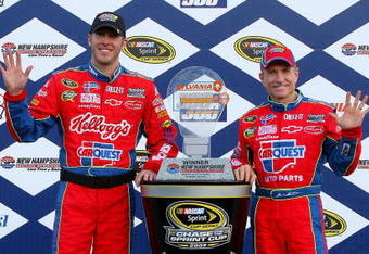 LOUDON, NH - SEPTEMBER 20:  Mark Martin (R), driver of the #5 CARQUEST/Kellogg's Chevrolet, and crew chief Alan Gustafson celebrates with the trophy in victory lane after winning the NASCAR Sprint Cup Series Sylvania 300 at the New Hampshire Motor Speedway on September 20, 2009 in Loudon, New Hampshire.  (Photo by Jason Smith/Getty Images for NASCAR)