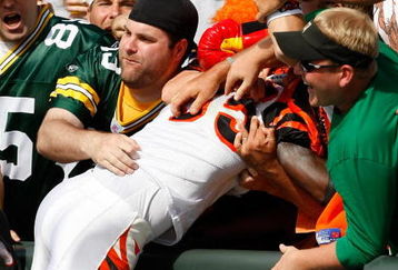 GREEN BAY, WI - SEPTEMBER 20: Wide receiver Chad Ochocinco #85 of the Cincinnati Bengals jumps in the stands to celebrate a touchdown as he does the Lambeau Leap against the Green Bay Packers at Lambeau Field on September 20, 2009 in Green Bay, Wisconsin. The Bengals defeated the Packers 31-24. (Photo by Scott Boehm/Getty Images)