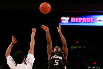 NEW YORK - MARCH 12:  Deonta Vaughn #5 of the Cincinnati Bearcats shoots over Ronald Ramon #4 of the Pittsburgh Panthers during the 2008 Big East Men's Basketball Championship at Madison Square Garden on March 12, 2008 in New York City.  (Photo by Jim McIsaac/Getty Images)