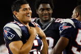 FOXBORO, MA - AUGUST 7: Tedy Bruschi #54 of the New England Patriots laughs from the sideline against the Baltimore Ravens during the preseason game at Gillette Stadium on August 7, 2008 in Foxboro, Massachusetts. (Photo by Jim Rogash/Getty Images)