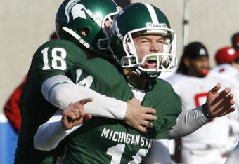 EAST LANSING, MI - NOVEMBER 01:  Brett Swenson #14 of the Michigan State Spartans reacts with Aaron Bates #18 after kicking game winning field goal to beat the Wisconsin Badgers 25-24 on November 1, 2008 at Spartan Stadium in East Lansing, Michigan.  (Photo by Gregory Shamus/Getty Images)