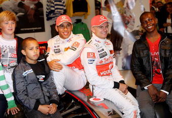 LONDON, ENGLAND - SEPTEMBER 17:  Formula 1 drivers Lewis Hamilton (L) and Heikki Kovalainen pose for a photograph as they launch their Grand Prix-themed boyswear range 'Living the Dream' produced exclusively by M&S with Vodafone McLaren Mercedes at Marks and Spencer Marble Arch on September 17, 2009 in London, England.  (Photo by Chris Jackson/Getty Images)