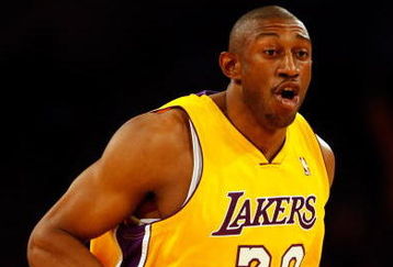 LOS ANGELES, CA - APRIL 03:  DJ Mbenga #28 of the Los Angeles Lakers gestures against the Houston Rockets during the game at Staples Center on April 3, 2009 in Los Angeles, California.  The Lakers defeated the Rockets 93-81. NOTE TO USER: User expressly acknowledges and agrees that, by downloading and/or using this Photograph, user is consenting to the terms and conditions of the Getty Images License Agreement.  (Photo by Jeff Gross/Getty Images)