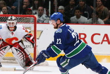 VANCOUVER, CANADA - MARCH 30:  Daniel Sedin #22 of the Vancouver Canucks is seen in position against  goalie Miikka Kiprusoff #34 of the Calgary Flames during the game at General Motors Place on March 30, 2008, in Vancouver, Canada.   (Photo by Kim Stallknecht/Getty Images)  