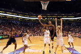 PHOENIX - AUGUST 08:  Tamika Catchings #24 of the Indiana Fever lays up a shot past Penny Taylor #13 of the Phoenix Mercury during the WNBA game at US Airways Center on August 8, 2009 in Phoenix, Arizona. NOTE TO USER: User expressly acknowledges and agrees that, by downloading and or using this photograph, User is consenting to the terms and conditions of the Getty Images License Agreement.  (Photo by Christian Petersen/Getty Images)