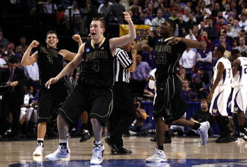 PORTLAND, OR - MARCH 21:  (C) Robbie Hummel #4 of the Purdue Boilermakers along with (L) Chris Kramer #3 and (R) E'Twaun Moore #33 celebrate after defeating the Washington Huskies during the second round of the NCAA Division I Men's Basketball Tournament at the Rose Garden on March 21, 2009 in Portland, Oregon. The Boilermakers defeated the Huskies 76-74 to advance to the Sweet 16.  (Photo by Jonathan Ferrey/Getty Images)