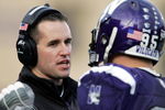 EVANSTON, IL - NOVEMBER 11:  Head coach Pat Fitzgerald of the Northwestern Wildcats talks to Kevin Mims #95 on the sidelines during a game against the Ohio State Buckeyes on November 11, 2006 at Ryan Field in Evanston, Illinois. Ohio State defeated Northwestern 54-10.  (Photo by Jonathan Daniel/Getty Images)