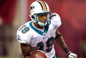 TAMPA, FL - AUGUST 27:  Receiver Ted Ginn, Jr. #19 of the Miami Dolphins runs the ball on a kick off against the Tampa Bay Buccaneers during a preseason game at Raymond James Stadium on August 27, 2009 in Tampa, Florida.  (Photo by J. Meric/Getty Images)