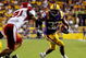 BATON ROUGE, LA - SEPTEMBER 19:  Charles Scott #32 of the Louisiana State University Tigers tries to avoid a tackle by Trace Wilson #71 of the University of Louisiana-Lafatette Ragin' Cajuns at Tiger Stadium on September 19, 2009 in Baton Rouge, Louisiana.  The Tigers defeated the Cajuns 31-3.  (Photo by Chris Graythen/Getty Images)