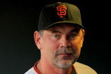 DENVER - JULY 24:  Manager Bruce Bochy #15 of the San Francisco Giants looks on from the dugout against the Colorado Rockies at Coors Field on July 24, 2009 in Denver, Colorado. The Giants defeated the Rockies 3-1.  (Photo by Doug Pensinger/Getty Images)