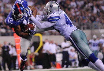 ARLINGTON, TX - SEPTEMBER 20:  Wide receiver Steve Smith #12 of the New York Giants dives for a touchdown against Gerald Sensabaugh #43 of the Dallas Cowboys at Cowboys Stadium on September 20, 2009 in Arlington, Texas.  (Photo by Ronald Martinez/Getty Images)