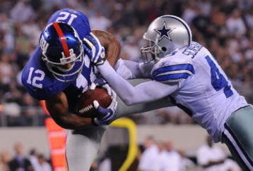 ARLINGTON, TX - SEPTEMBER 20:  Wide receiver Steve Smith #12 of the New York Giants dives for a touchdown against Gerald Sensabaugh #43 of the Dallas Cowboys at Cowboys Stadium on September 20, 2009 in Arlington, Texas.  (Photo by Ronald Martinez/Getty Images)