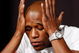 LAS VEGAS - SEPTEMBER 16: Boxer Floyd Mayweather Jr. rubs his face during the final news conference for his bout against Juan Manuel Marquez at the MGM Grand Hotel/Casino September 16, 2009 in Las Vegas, Nevada. The two will fight at the MGM Grand Garden Arena on September 19 in Las Vegas. (Photo by Ethan Miller/Getty Images)