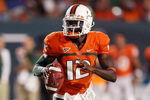FORT LAUDERDALE, FL - SEPTEMBER 17: Quarterback Jacory Harris #12 of the Miami Hurricanes scrambles against the Georgia Tech Yellow Jackets at Land Shark Stadium on September 17, 2009 in Fort Lauderdale, Florida.  (Photo by Doug Benc/Getty Images)
