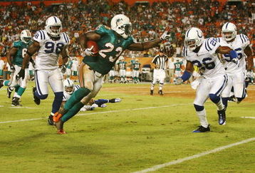 MIAMI - SEPTEMBER 21: Running back Ronnie Brown #23 of the Miami Dolphins prepares to stiff-arm defensive back Kelvin Hayden #26 of the Indianapolis Colts at Land Shark Stadium on September 21, 2009 in Miami, Florida. The Colts defeated the Dolphins 27-23.  (Photo by Doug Benc/Getty Images)