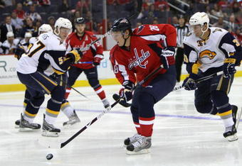 WASHINGTON - SEPTEMBER 21: Alexander Semin #28 of the Washington Capitals controls the puck against Patrick Kaleta #36 of the Buffalo Sabres during an NHL preseason hockey game on September 21, 2009 at the Verizon Center in Washington, DC.. (Photo by Ned Dishman/Getty Images)