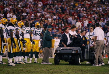 TAMPA - NOVEMBER 24:  Chad Clifton #76 of the Green Bay Packers is taken off the field after injuring his pelvis on a play during the game against the Tampa Bay Buccaneers on November 24, 2002 at Raymond James Stadium in Tampa, Florida. The Buccs beat the Packers 21-7. (Photo by Doug Pensinger/Getty Images) 