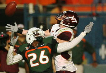 MIAMI - NOVEMBER 13:  Defensive back Anthony Reddick #26 of the Miami Hurricanes knocks the pass away from wide receiver Danny Coale #19 of the Virginia Tech Hokies at Dolphin Stadium on November 13, 2008 in Miami, Florida. Miami defeated Virginia Tech 16-14.  (Photo by Doug Benc/Getty Images)