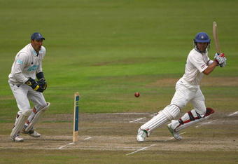 MANCHESTER, UNITED KINGDOM - JULY 22:  Lou Vincent of Lancashire edges the ball towards the boundary, as Nic Pothas of Hampshire looks on during the Liverpool and Victoria County Championship Division One match between Lancashire and Hampshire at Old Trafford on July 22, 2008 in Manchester, England.  (Photo by Matthew Lewis/Getty Images)