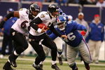 EAST RUTHERFORD, NJ - NOVEMBER 16:  Joe Flacco #5  of the Baltimore Ravens scrambles as Barry Cofield #96 of the New York Giants gives chase during their game on November 16, 2008 at Giants Stadium in East Rutherford, New Jersey.  (Photo by Al Bello/Getty Images)