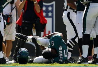 CHARLOTTE, NC - SEPTEMBER 13:  Quarterback Donovan McNabb #5 of the Philadelphia Eagles lays on the ground after injuring his knee in the second half of their NFL season opener against the Carolina Panthers at Bank of America Stadium on September 13, 2009 in Charlotte, North Carolina. McNabb did not return to the game. (Photo by Streeter Lecka/Getty Images)