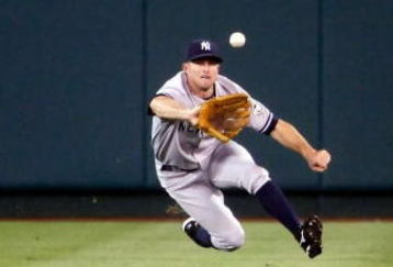 ANAHEIM, CA - SEPTEMBER 22:  Center fielder Brett Gardner #11 of the New York Yankees dives to make a catch on a ball hit by Chone Figgins of the Los Angeles Angels of Anaheim in the first inning at Angel Stadium on September 22, 2009 in Anaheim, California.  (Photo by Jeff Gross/Getty Images)