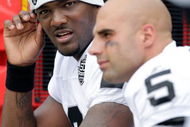 KANSAS CITY, MO - SEPTEMBER 20:  Quarterback JaMarcus Russell #2 of the Oakland Raiders talks with Bruce Gradkowski #5 on the bench during the game against the Kansas City Chiefs at Arrowhead Stadium on September 20, 2009 in Kansas City, Missouri.  (Photo by Jamie Squire/Getty Images)