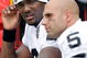 KANSAS CITY, MO - SEPTEMBER 20:  Quarterback JaMarcus Russell #2 of the Oakland Raiders talks with Bruce Gradkowski #5 on the bench during the game against the Kansas City Chiefs at Arrowhead Stadium on September 20, 2009 in Kansas City, Missouri.  (Photo by Jamie Squire/Getty Images)