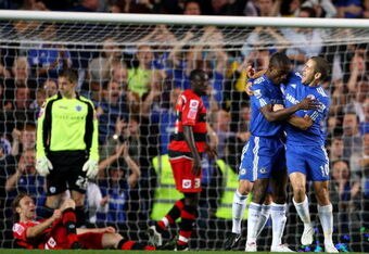 LONDON, ENGLAND - SEPTEMBER 23:  Salomon Kalou of Chelsea celebrates scoring with Joe Cole against Queens Park Rangers during the Carling Cup third round match between Chelsea and Queens Park Rangers at Stamford Bridge on September 23, 2009 in London, England.  (Photo by Phil Cole/Getty Images)