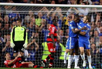 LONDON, ENGLAND - SEPTEMBER 23:  Salomon Kalou of Chelsea celebrates scoring with Joe Cole against Queens Park Rangers during the Carling Cup third round match between Chelsea and Queens Park Rangers at Stamford Bridge on September 23, 2009 in London, England.  (Photo by Phil Cole/Getty Images)