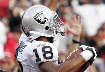 SAN FRANCISCO - AUGUST 22:  Oakland Raiders wide receiver Louis Murphy #18 raises celebrates after making a touchdown in the 2nd quarter as the San Francisco 49ers host the Oakland Raiders at Candlestick Park August 22, 2009 in San Francisco, California.  (Photo by David Paul Morris/Getty Images)