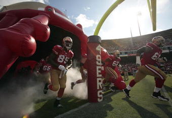 SAN FRANCISCO - AUGUST 22:  San Francisco 49ers tight end Vernon Davis #85, San Francisco 49ers center Eric Heitmann #66, San Francisco 49ers guard Chilo Rachal #62 and San Francisco 49ers guard Adam Snyder #68 run out onto the field in to start the game as the San Francisco 49ers host the Oakland Raiders at Candlestick Park August 22, 2009 in San Francisco, California.  (Photo by David Paul Morris/Getty Images)
