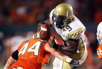 FORT LAUDERDALE, FL - SEPTEMBER 17:  Quarterback Josh Nesbitt #9 of the Georgia Tech Yellow Jackets is brought down by linebacker Colin McCarthy #44 of the Miami Hurricanes at Land Shark Stadium on September 17, 2009 in Fort Lauderdale, Florida. Miami defeated Georgia Tech 33-17.  (Photo by Doug Benc/Getty Images)