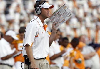KNOXVILLE, TN - SEPTEMBER 12: Lane Kiffin, head coach of the Tennessee Volunteers coaches from the sideline against the UCLA Bruins on September 12, 2009 at Neyland Stadium in Knoxville, Tennessee. UCLA beat Tennessee 19-15. (Photo by Joe Murphy/Getty Images)