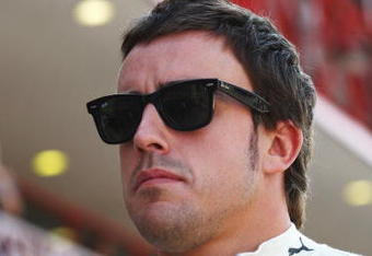VALENCIA, SPAIN - AUGUST 22:  Fernando Alonso of Spain and Renault walks down the pitlane during the final practice session prior to qualifying for the European Formula One Grand Prix at the Valencia Street Circuit on August 22, 2009, in Valencia, Spain.  (Photo by Ryan Pierse/Getty Images)