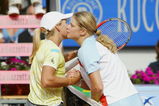 ROME, ITALY - MAY 18:  Justine Henin of Belgium and Kim Clijsters of Belgium kiss at the net after Henin won 7-5, 6-2 in their Semi-Final match during the WTA Tennis Masters held at the Foro Italico in Rome, Italy on May 18, 2002. (Photo Alex Livesey/Getty Images)