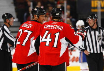 OTTAWA - SEPTEMBER 19:  Alex Kovalev #27 and Jonathan Cheechoo #41 of the Ottawa Senators discuss strategy during a preseason game against the Montreal Canadiens at Scotiabank Place on September 19, 2009 in Ottawa, Canada.  The Ottawa Senators defeated the Montreal Canadiens 6-1. (Photo by Phillip MacCallum/Getty Images)