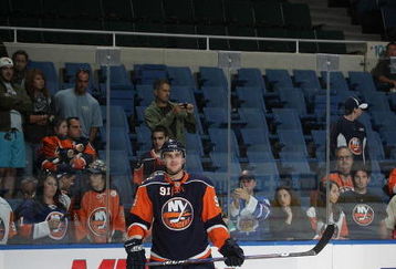 UNIONDALE, NY - SEPTEMBER 23:  John Tavares #91 of the New York Islanders skates in warmups prior to playing against the New Jersey Devils in preseason action at the Nassau Veterans Memorial Coliseum on September 23, 2009 in Uniondale, New York.  (Photo by Bruce Bennett/Getty Images)