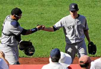 ANAHEIM, CA - SEPTEMBER 23: Pitcher Ian Kennedy #39 (R) is congratulated by catcher Jose Molina #26 of the New York Yankees after pitching out of a jam with the bases loaded in the eighth inning against Los Angeles Angels of Anaheim at Angel Stadium on September 23, 2009 in Anaheim, California. Yankees won, 3-2.  (Photo by Kevork Djansezian/Getty Images)