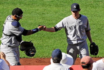 ANAHEIM, CA - SEPTEMBER 23: Pitcher Ian Kennedy #39 (R) is congratulated by catcher Jose Molina #26 of the New York Yankees after pitching out of a jam with the bases loaded in the eighth inning against Los Angeles Angels of Anaheim at Angel Stadium on September 23, 2009 in Anaheim, California. Yankees won, 3-2.  (Photo by Kevork Djansezian/Getty Images)