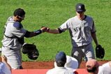 ANAHEIM, CA - SEPTEMBER 23: Pitcher Ian Kennedy #39 (R) is congratulated by catcher Jose Molina #26 of the New York Yankees after pitching out of a jam with the bases loaded in the eighth inning against Los Angeles Angels of Anaheim at Angel Stadium on September 23, 2009 in Anaheim, California. Yankees won, 3-2.  (Photo by Kevork Djansezian/Getty Images)