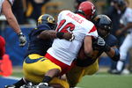 BERKELEY, CA - SEPTEMBER 12:  Eddie Young #9 and Tyson Aluala #44 of the California Golden Bears sack Matt Nichols #16 of the Eastern Washington Eagles at Memorial Stadium on September 12, 2009 in Berkeley, California.  (Photo by Jed Jacobsohn/Getty Images)