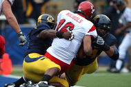 BERKELEY, CA - SEPTEMBER 12:  Eddie Young #9 and Tyson Aluala #44 of the California Golden Bears sack Matt Nichols #16 of the Eastern Washington Eagles at Memorial Stadium on September 12, 2009 in Berkeley, California.  (Photo by Jed Jacobsohn/Getty Images)