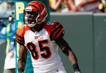 GREEN BAY, WI - SEPTEMBER 20: Wide receiver Chad Ochocinco #85 of the Cincinnati Bengals runs with the football for a touchdown after a pass reception against the Green Bay Packers at Lambeau Field on September 20, 2009 in Green Bay, Wisconsin. The Bengals defeated the Packers 31-24. (Photo by Scott Boehm/Getty Images)
