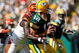 GREEN BAY, WI - SEPTEMBER 20: Quarterback Aaron Rogers #12 of the Green Bay Packers is sacked by defensive end Antwan Odem #98 of the Cincinnati Bengals at Lambeau Field on September 20, 2009 in Green Bay, Wisconsin. The Bengals defeated the Packers 31-24. (Photo by Scott Boehm/Getty Images)