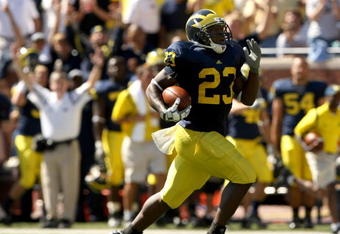 ANN ARBOR, MI - SEPTEMBER 19:  Running back Carlos Brown #23 of the Michigan Wolverines breaks away on  a 90 yard touchdown run against the Eastern Michigan Eagles at Michigan Stadium on September 19, 2009 in Ann Arbor, Michigan.  (Photo by Stephen Dunn/Getty Images)