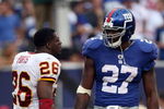 EAST RUTHERFORD, NJ - SEPTEMBER 13:  Brandon Jacobs #27 of the New York Giants talks with Clinton Portis #26 of the Washington Redskins on September 13, 2009 at Giants Stadium in East Rutherford, New Jersey.  (Photo by Jim McIsaac/Getty Images)
